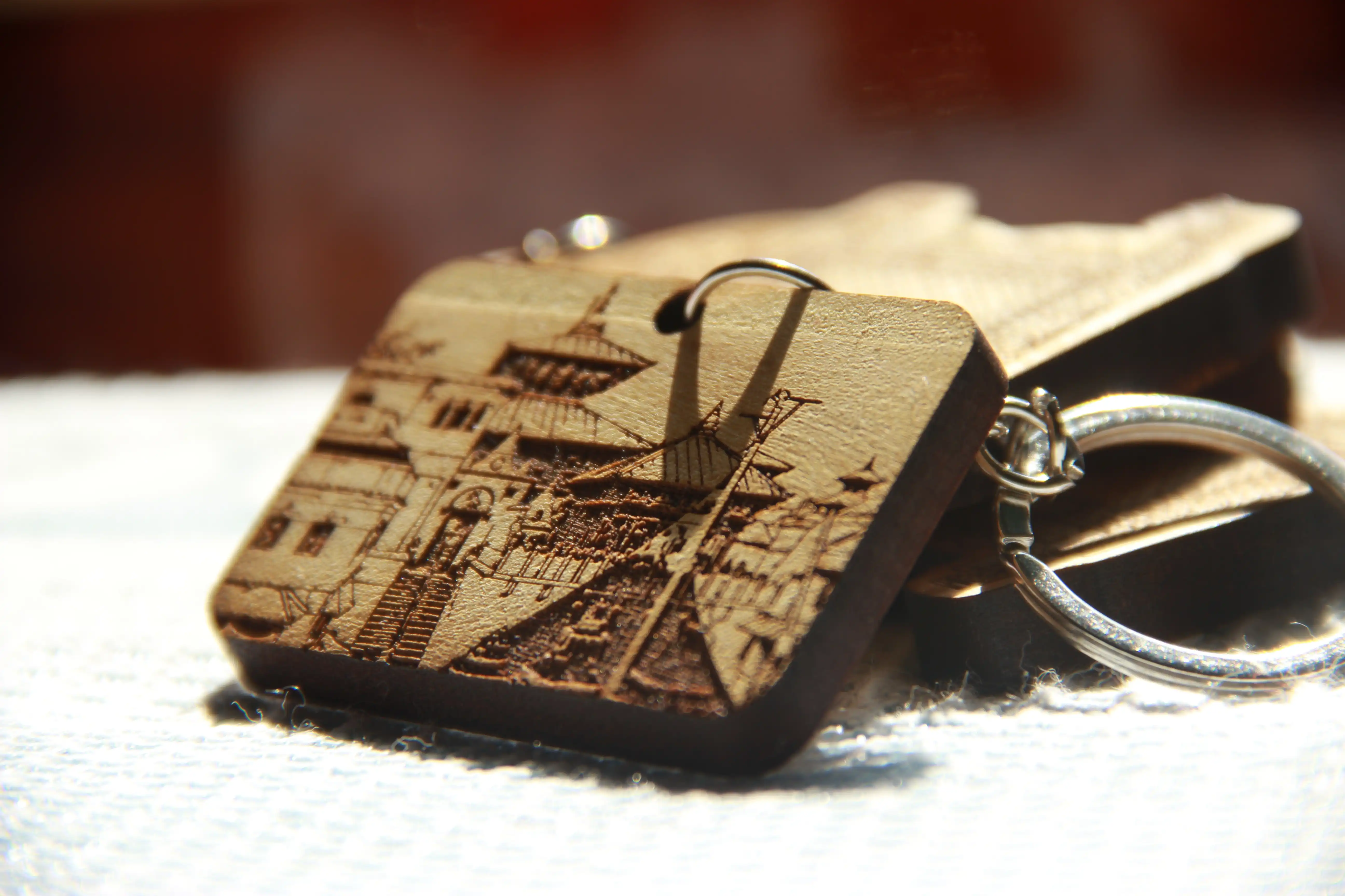 Handcrafted wooden keyrings and engraved keepsakes displayed in the studio